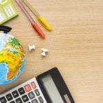 top-view-back-school-supplies-with-calculator-globe